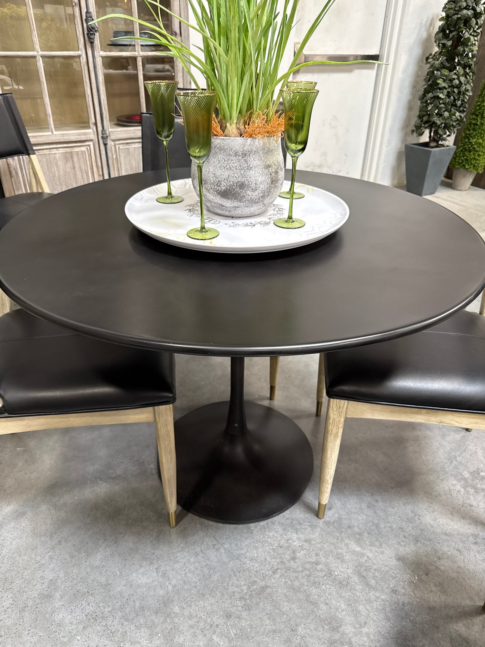 Black round metal dining table
